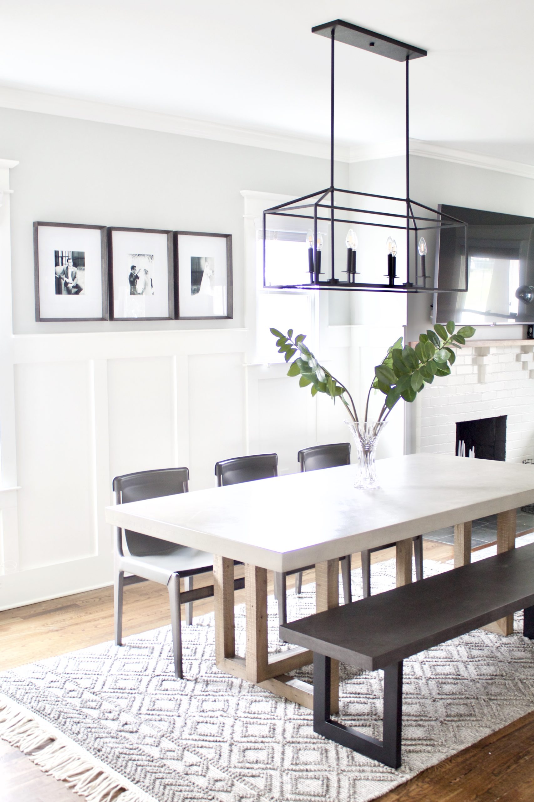 An 8-light black linear chandelier that is sure to grab your attention but not overwhelm your view. We used this light fixture for our contemporary craftsman eat-in kitchen dining space. It features an open rectangular frame that holds two sets of four candelabra bulbs.